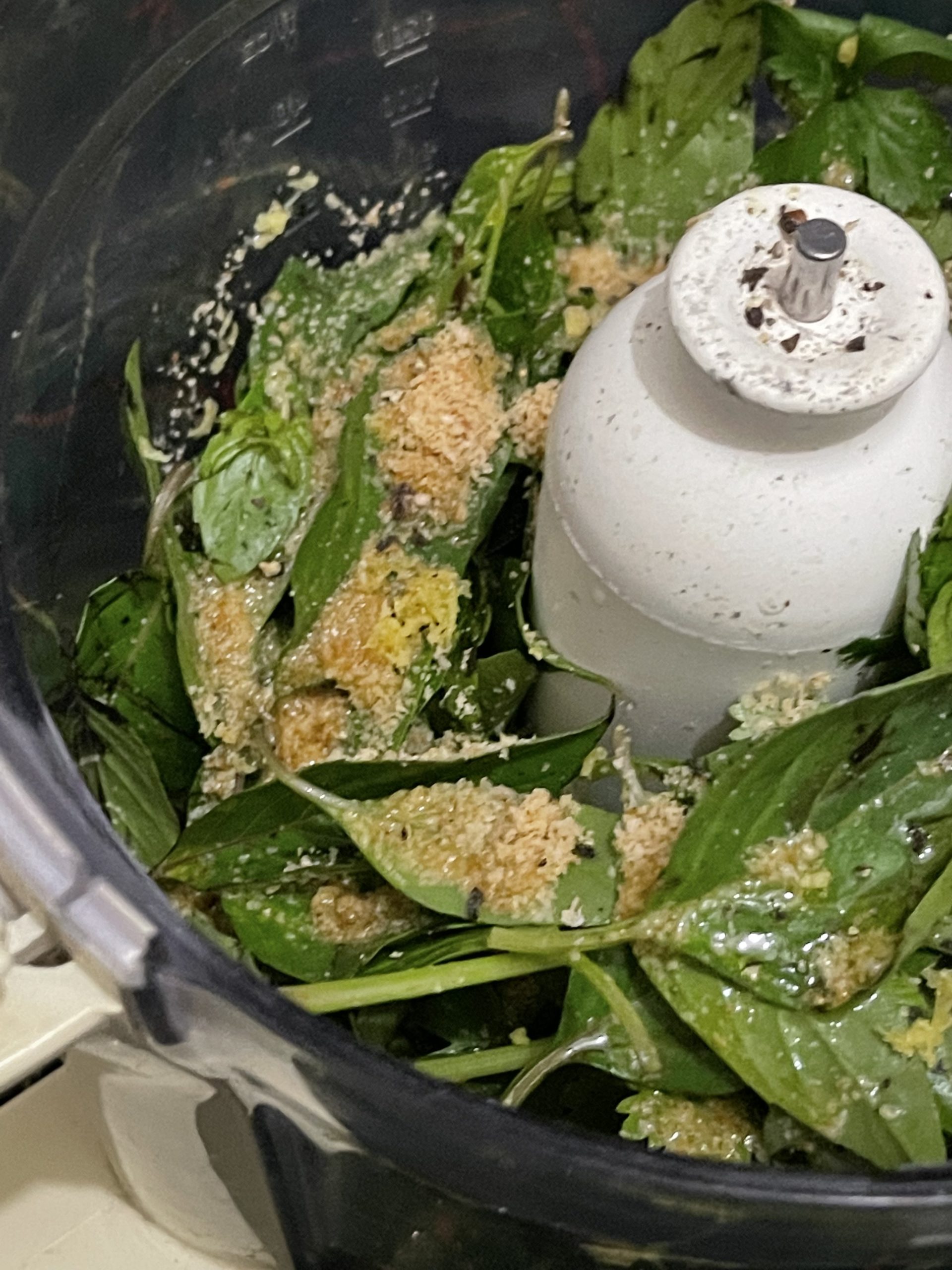 Spinach and seasonings in a food processor
