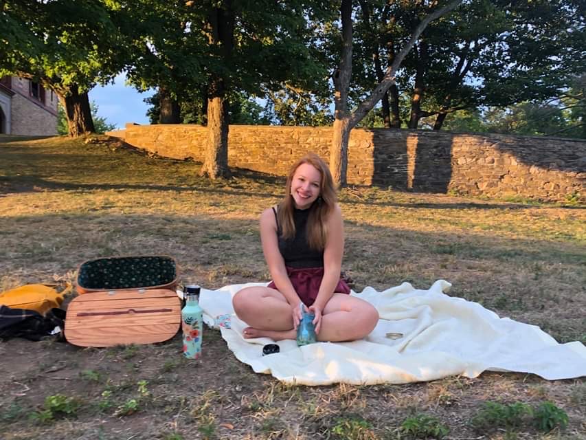 girl on a picnic blanket