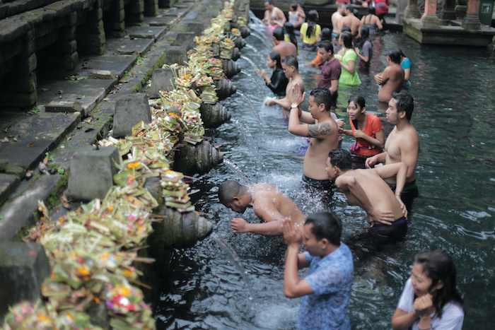 Locals bathing in a river. 