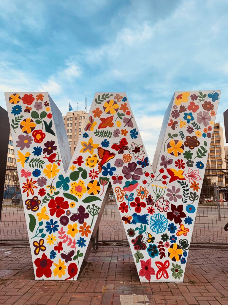 a large "W" decorated with flowers