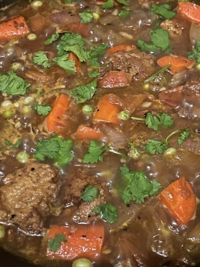 vegan beef stew completed with a sprinkle of cilantro on top.