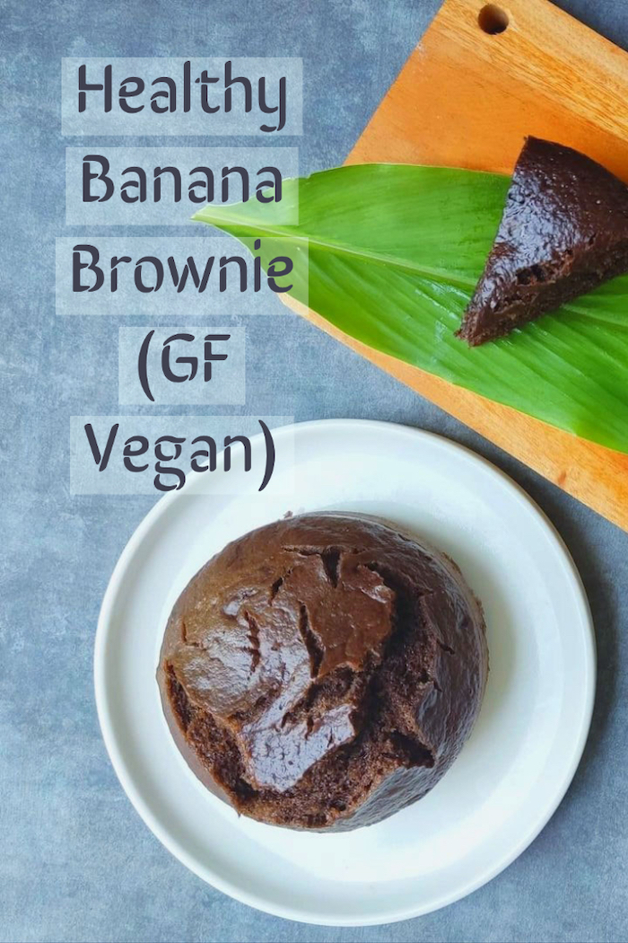 a vertical image of a round banana brownie on a white plate with a caption saying "healthy banana brownie (GF vegan)"