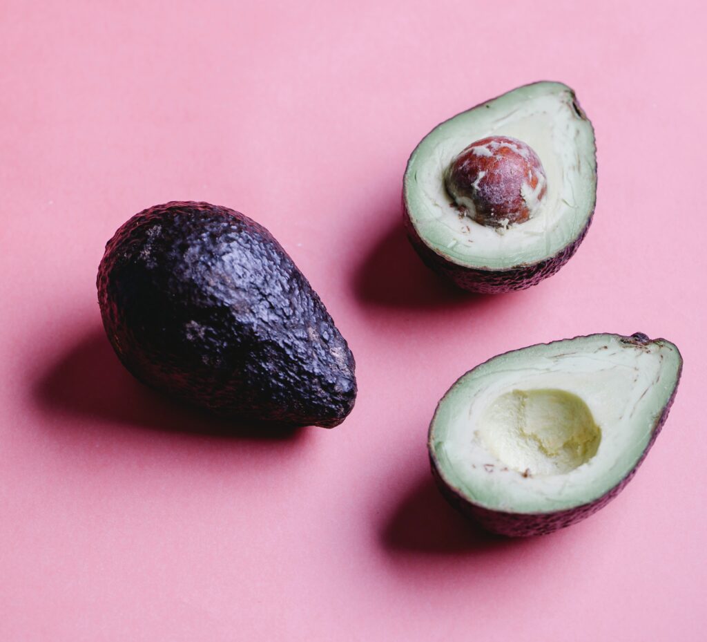 avocados against a pink background