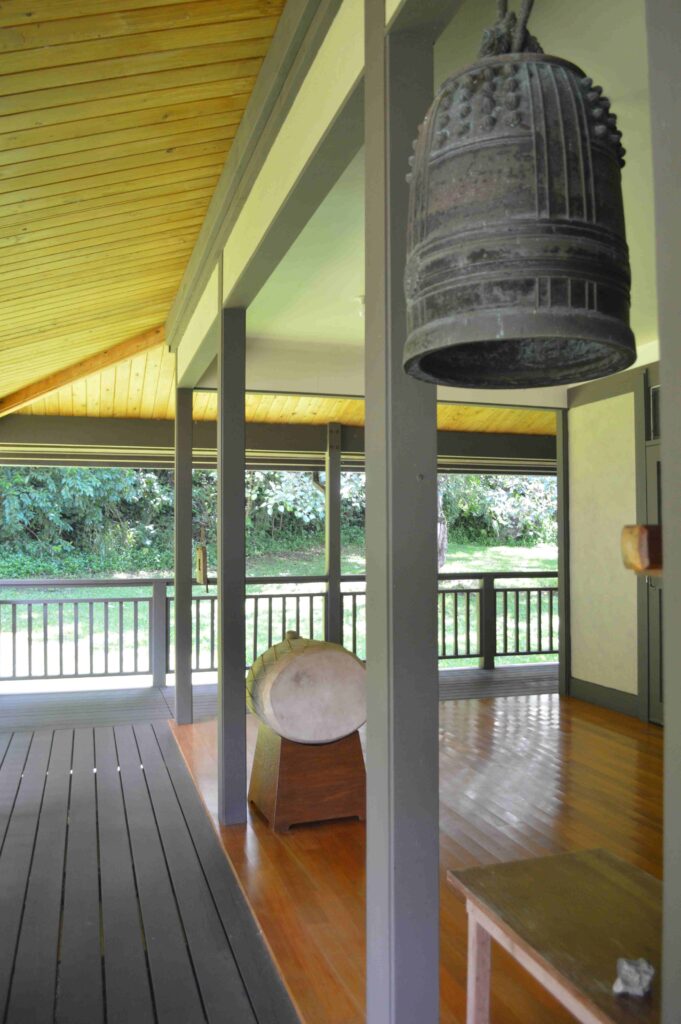 The densho, a large bell to signify when meditation will begin, as well as a ceremonial drum outside a Zen center.